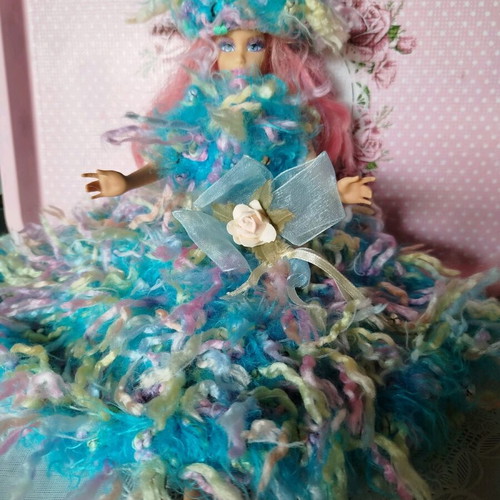Doll with handmade dress and hat used