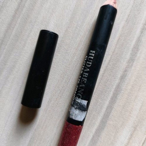 Lip pencil used dark red with glitter
