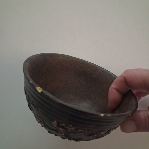 Replica vessel with embossed erotic scenes from Pella Museum, used