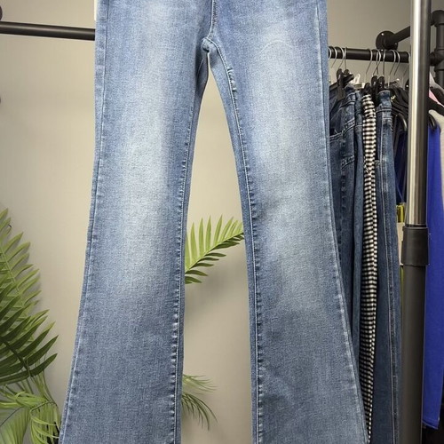 Light blue women's flared jeans with faded look