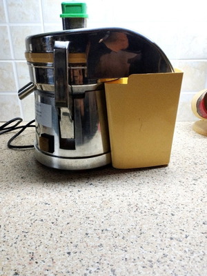 Professional juicer used, stainless steel with cracked plastic part