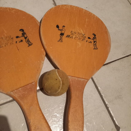 Wooden beach rackets used, pair with ball