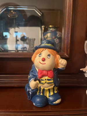 Vintage clown figurine piggy bank used with retro details