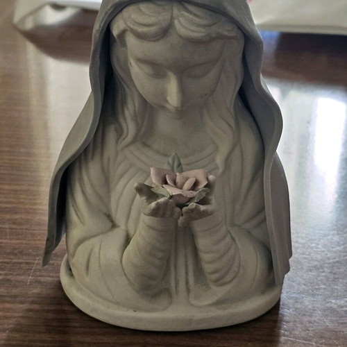 Decorative girl figurine used holding flower