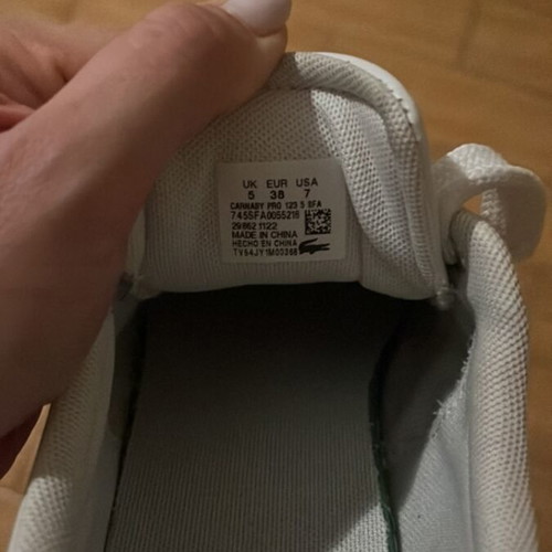 Lacoste sneakers used leather with gold details