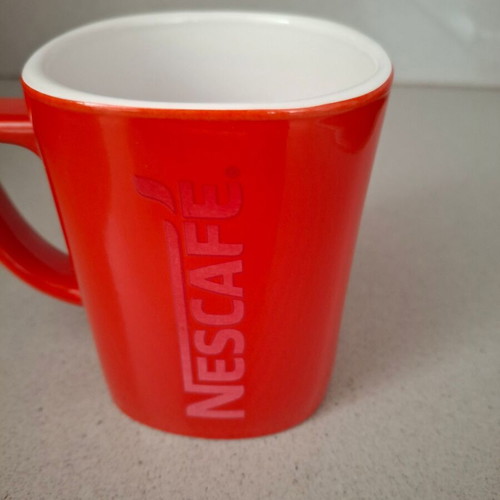 Nescafe mug used with red embossed letters, collectible