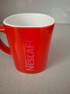 Nescafe mug used with red embossed letters, collectible