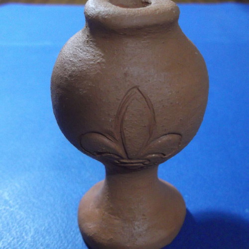 Clay oil lamp or water whistle with fleur-de-lis scouting emblem, used
