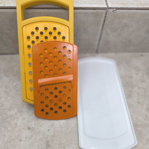 Tupperware grater with multiple cutting options