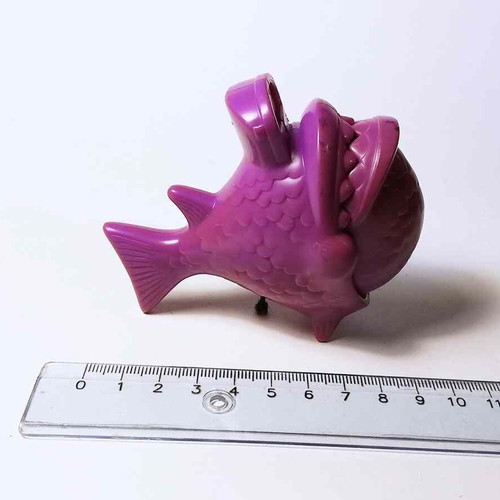 Plastic toy purple fish used with closing mouth