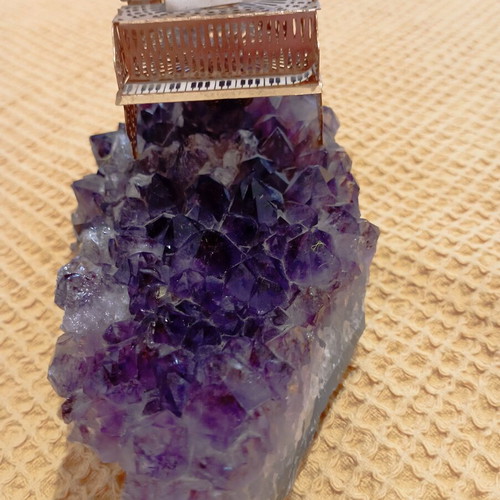 Vintage decorative piano on natural amethyst rock, gold-plated