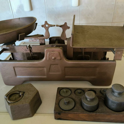 Old mechanical scale with authentic weights, vintage