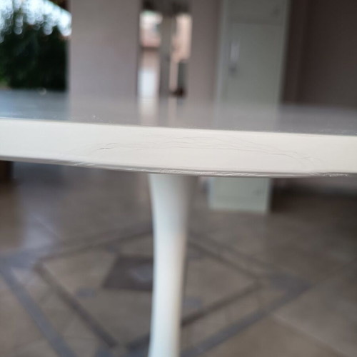 Round dining table with white MDF surface