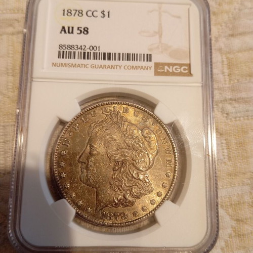 Morgan Dollar 1878 cc like new, certified by NGC AU 58