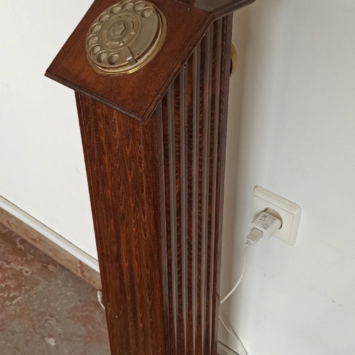 Antique hotel telephone used, wooden column with brass supports