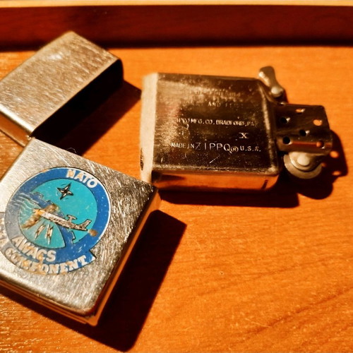 Collectible Zippo lighter 32 years old and handmade Okapi knife.