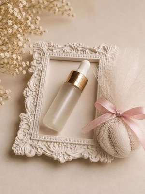Vintage plaster frame with perfume bottle