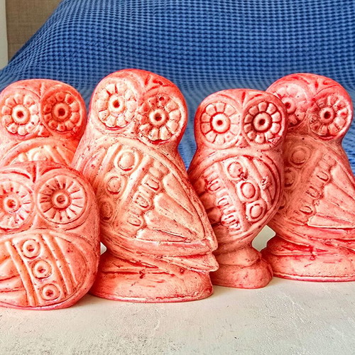 Set of five salmon pink owl figurines