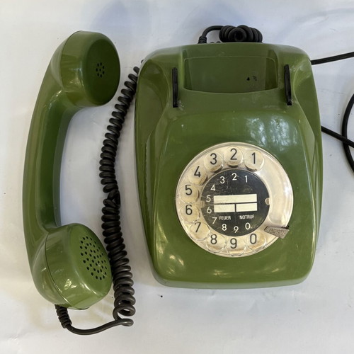 Vintage green telephone used, wired connection