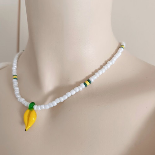Handmade white short necklace with glass banana pendant