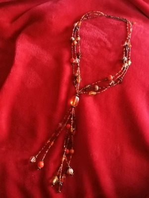 Necklace with beads in brown and amber shades like new