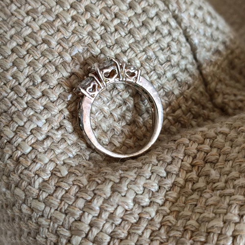Trilogy silver plated ring used with zircon and heart motifs