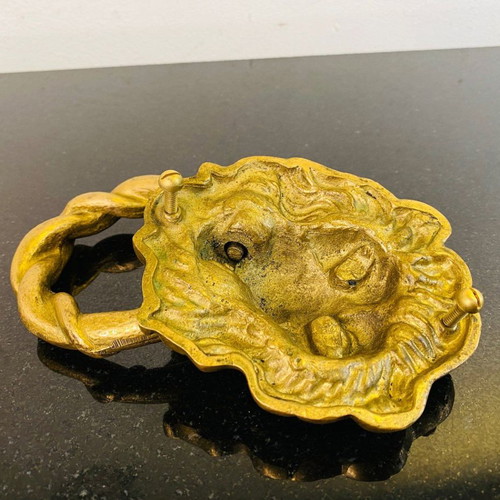 Bronze door knocker used with lion head and wooden base