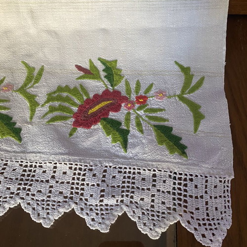 Handmade embroidered runner with red flowers and white crochet lace