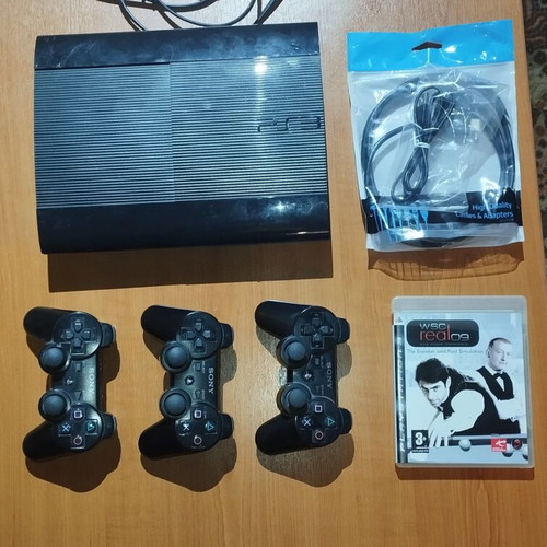 PS3 Super Slim 500GB console with three controllers and game