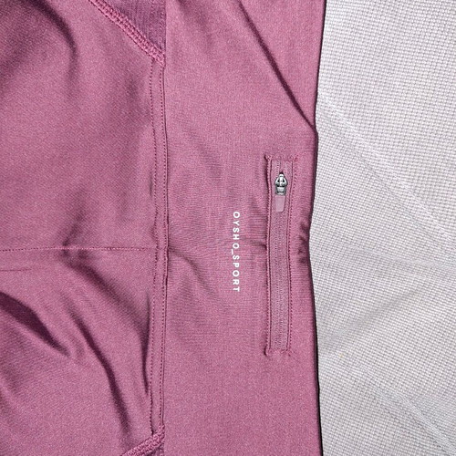 Women's leggings Bordeaux Oysho size Medium like new with mesh panels and zipper pocket