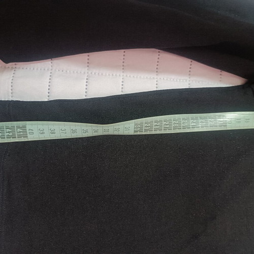 Pink Woman black crop top with long sleeves and ruffles