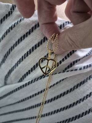 Vintage necklace with heart-shaped peace symbol pendant, like new