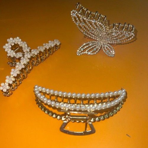Metal hair clips like new, 3 gold with designs