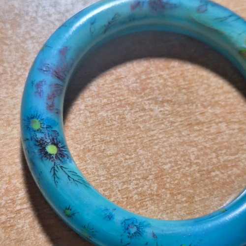 Petrol resin bracelet with flower designs like new