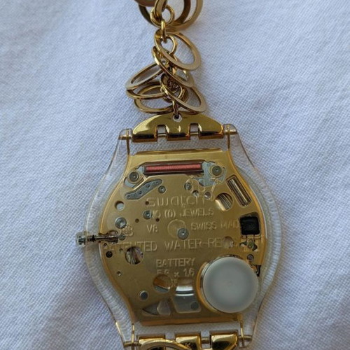 Swatch women's watch used with gold chain strap