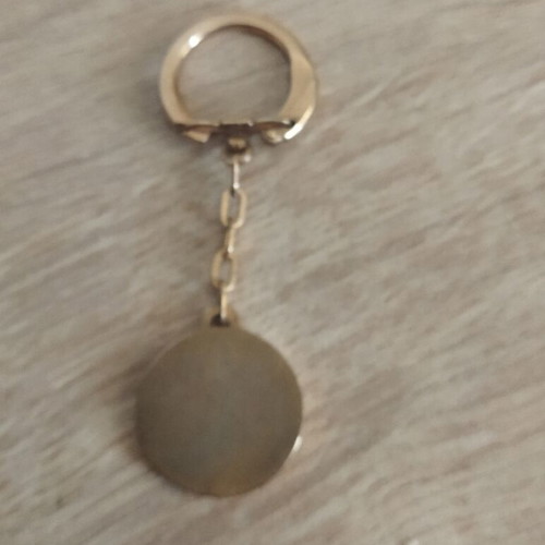 Kennedy keychain used, gold color