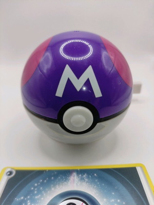 Masterball Zekrom figure and spinning top like new