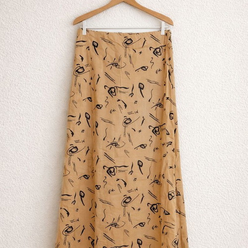Prénom women's skirt size Small like new, mustard with black line-art