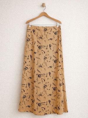 Prénom women's skirt size Small like new, mustard with black line-art