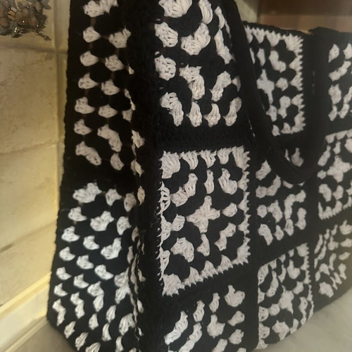 Handmade jute bag with black and white crochet motifs