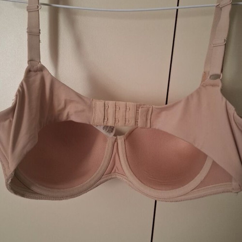 Beige bra new with small front tear