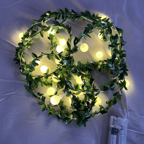 LED string lights with green leaves