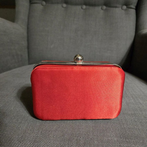 Red satin bag used with silver details and chain strap
