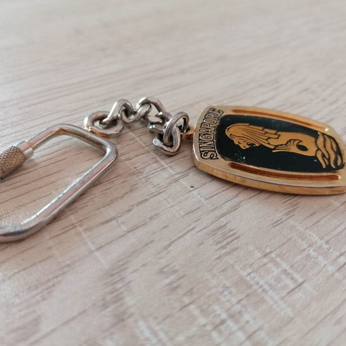 Vintage Singapore keychain used, metal, gold and silver colors
