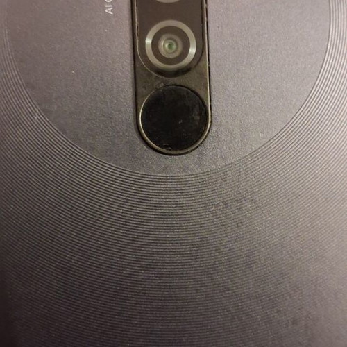 Xiaomi 9 smartphone with screen protector and case, gray