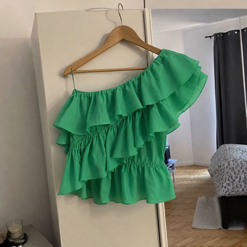 Green blouse with ruffles