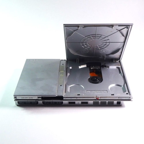 PlayStation 2 PS2 Slim silver console used for repair