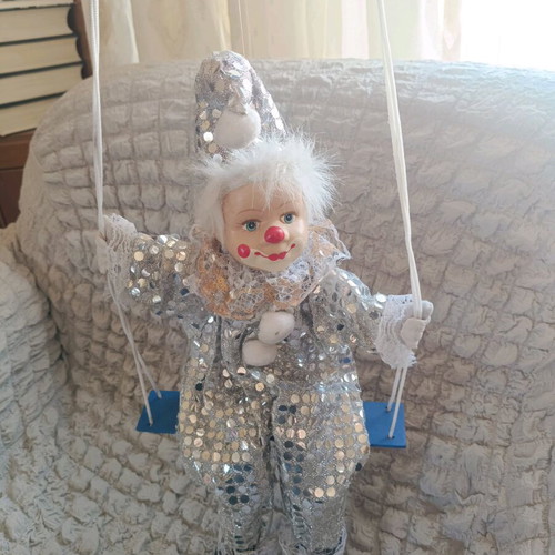 Vintage porcelain clown on swing like new, decorative