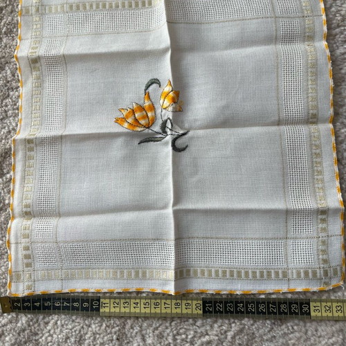 Embroidered doily used with flower design
