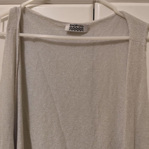 Sleeveless vest used with silver thread, size S